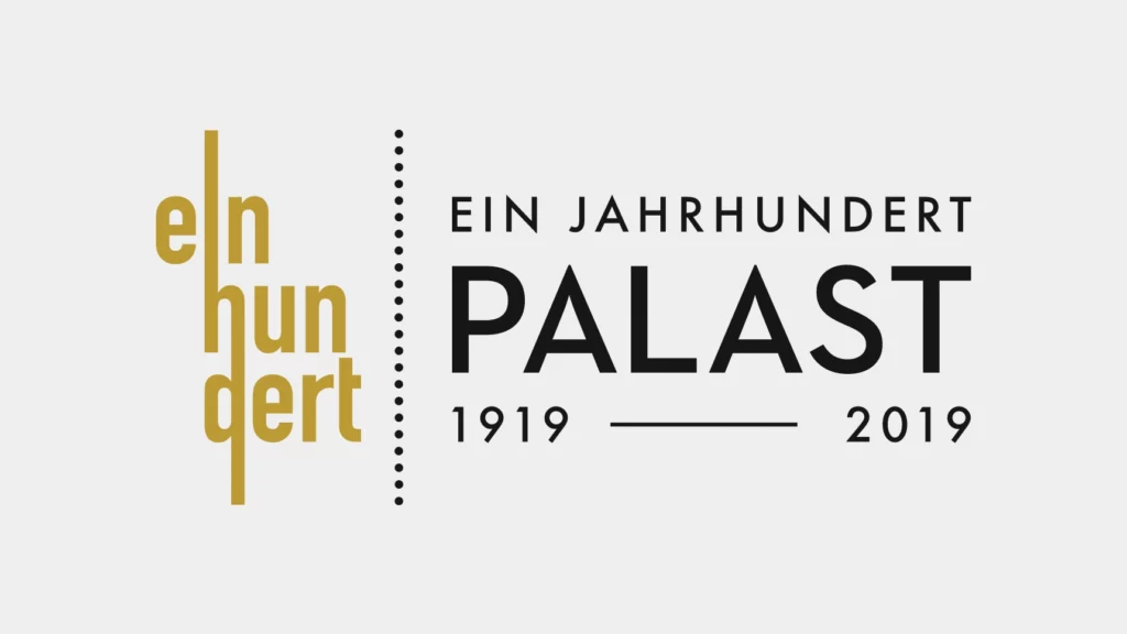 Ein Bild zeigt das Logo der Kampagne "100 Jahre Palast" des Friedrichstadtpalast Berlin