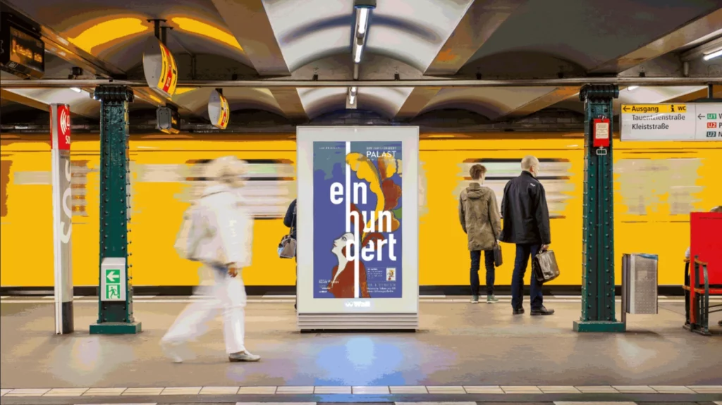 A picture shows a poster of the "100 years of the Palast" campaign of the Friedrichstadtpalast Berlin