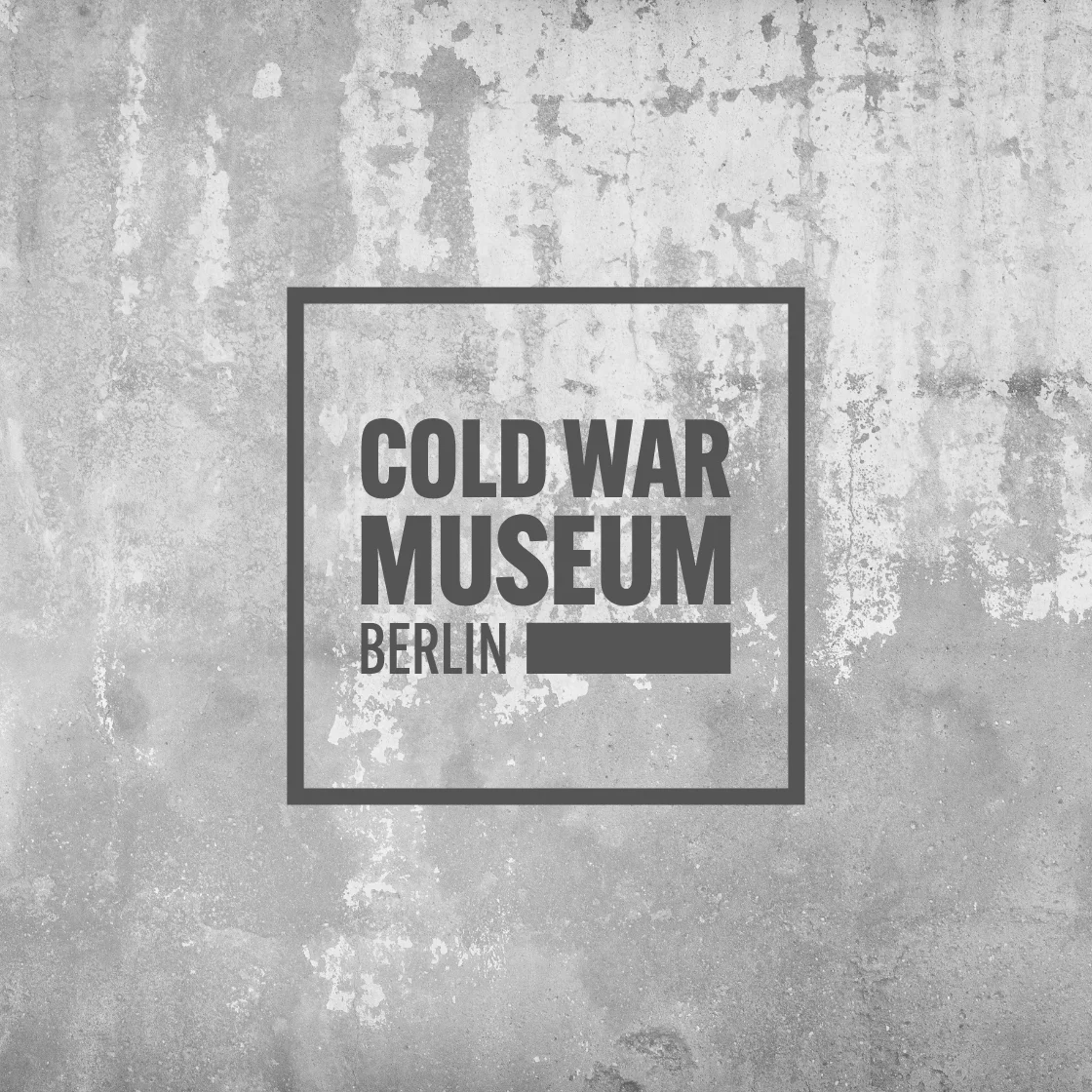 One picture shows a badge from the Cold War Museum in Berlin.