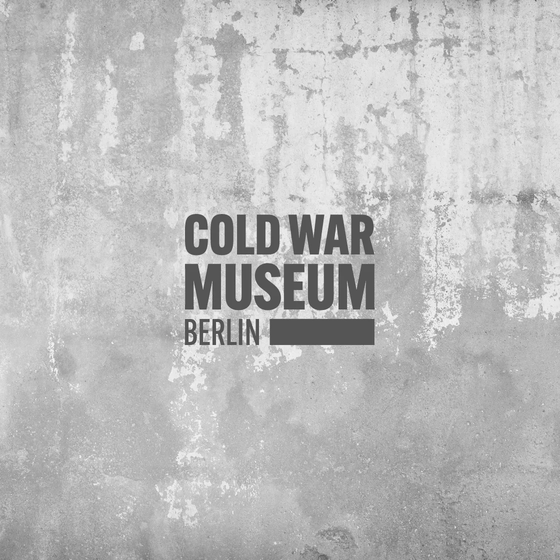 One picture shows a badge from the Cold War Museum in Berlin.