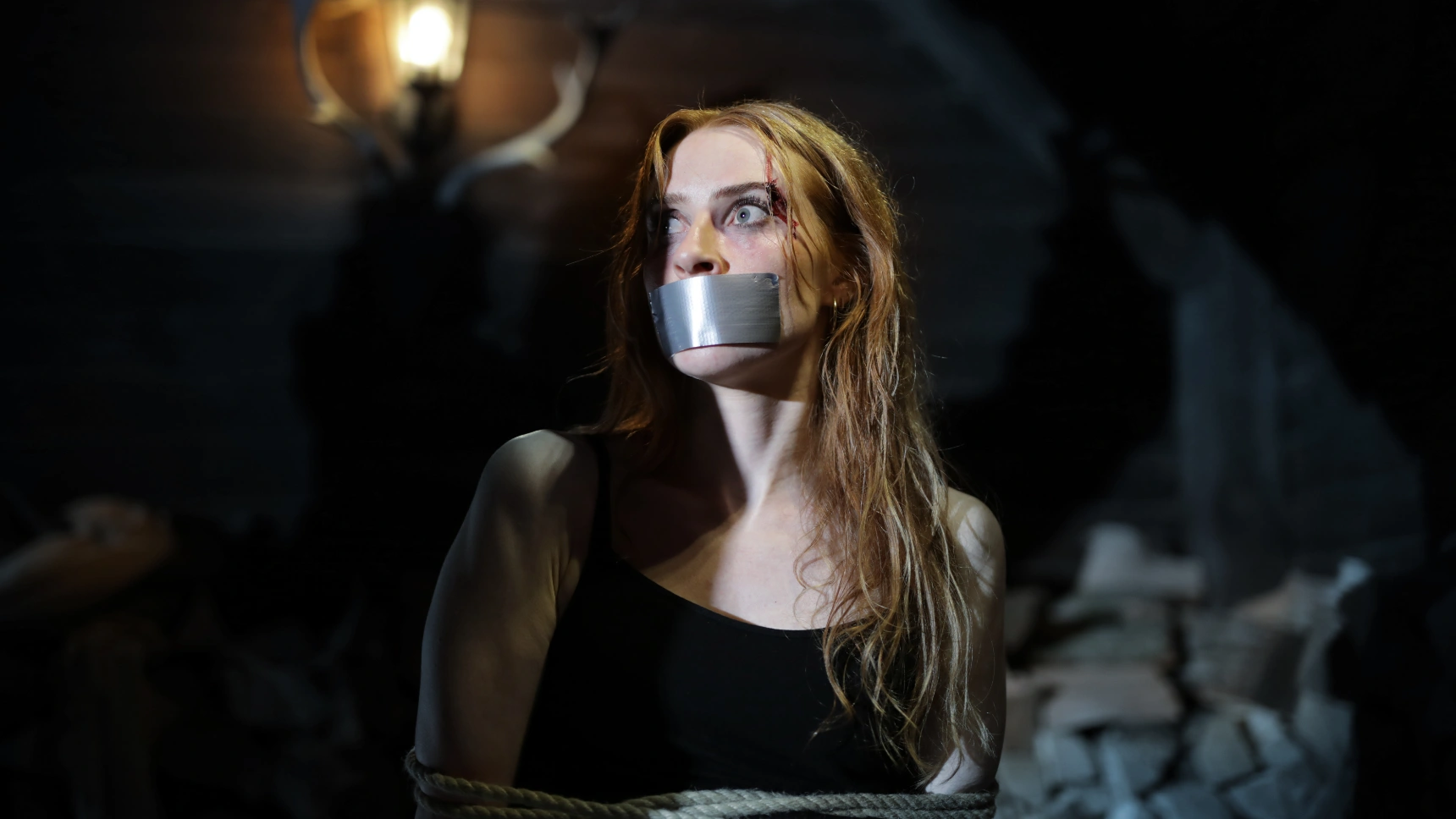 One picture shows a woman whose mouth is taped.