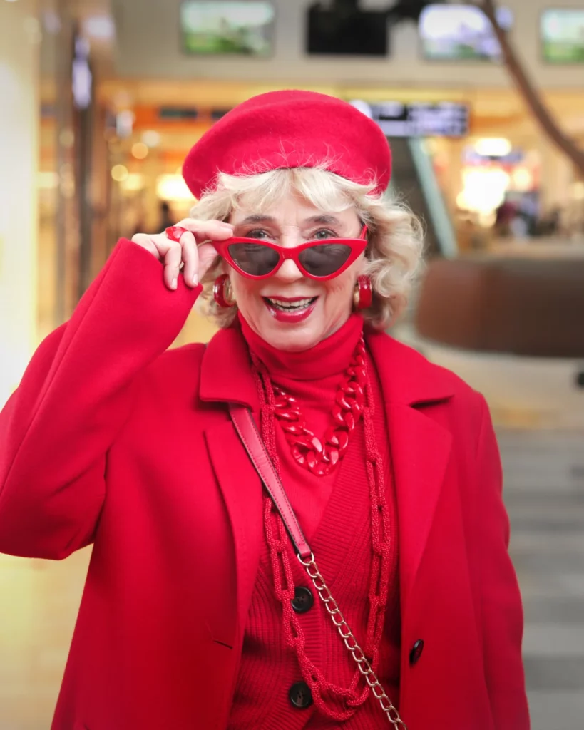 A picture shows a woman dressed completely in red with sunglasses in the Spandauer Arcaden shopping center in Berlin.